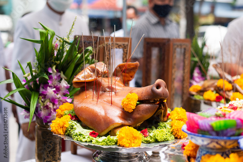 The pig's head sacrifice in the worship of house spirit in Asia tradition.