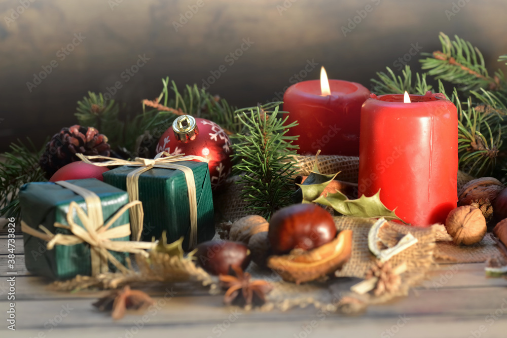traditional christmas decoration on wooden background with candles and gifts traditional christmas decoration on wooden background with candles and gifts