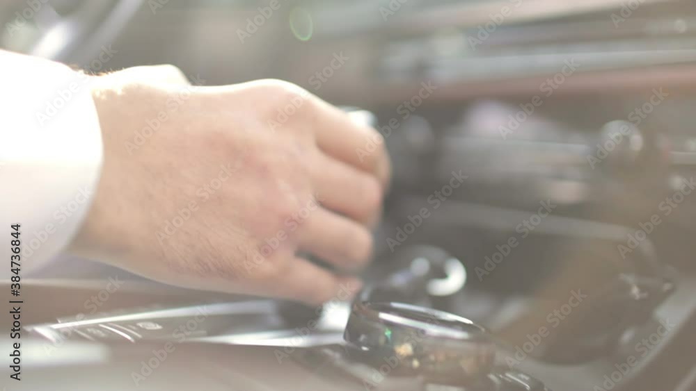 Man drives a car, close-up view inside the cabin Man drives a car, close-up view inside the cabin