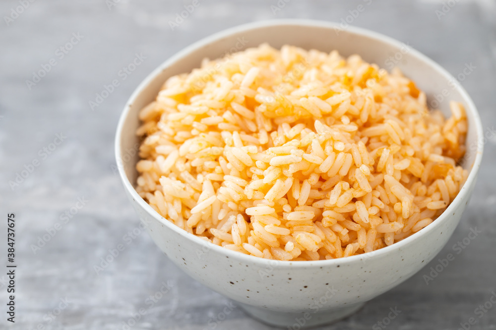 boiled rice with tomato in bowl on ceramic background boiled rice with tomato in bowl on ceramic background