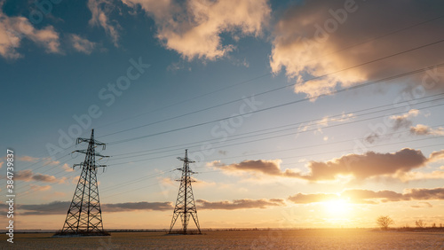 Power lines during a beautiful winter sunset.