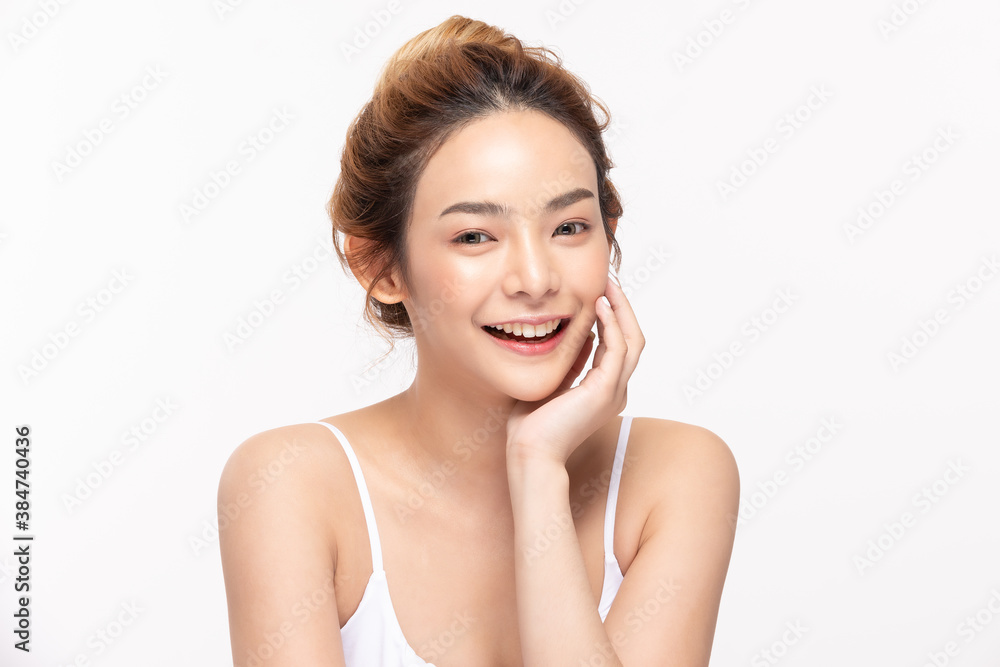 Beautiful Asian young woman touching soft cheek smile with clean fresh skin Happiness and cheerful with positive emotional,isolated on white background,Beauty Cosmetics and Facial treatment Concept Beautiful Asian young woman touching soft cheek smile with clean fresh skin Happiness and cheerful with positive emotional,isolated on white background,Beauty Cosmetics and Facial treatment Concept