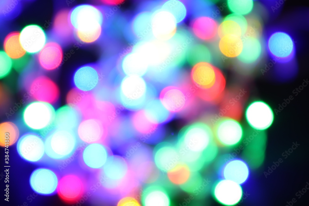 black abstract background of defocused bokeh colorful blurred beautiful shiny illuminate