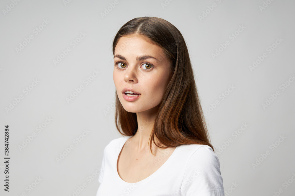 Side view of surprised woman with open mouth in t-shirt Side view of surprised woman with open mouth in t-shirt
