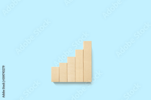 Ladder graph career path for business growth success process concept. Wood block increase step up