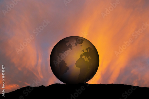 Fototapeta Naklejka Na Ścianę i Meble -  illustration of silhouette of the world at sunset
