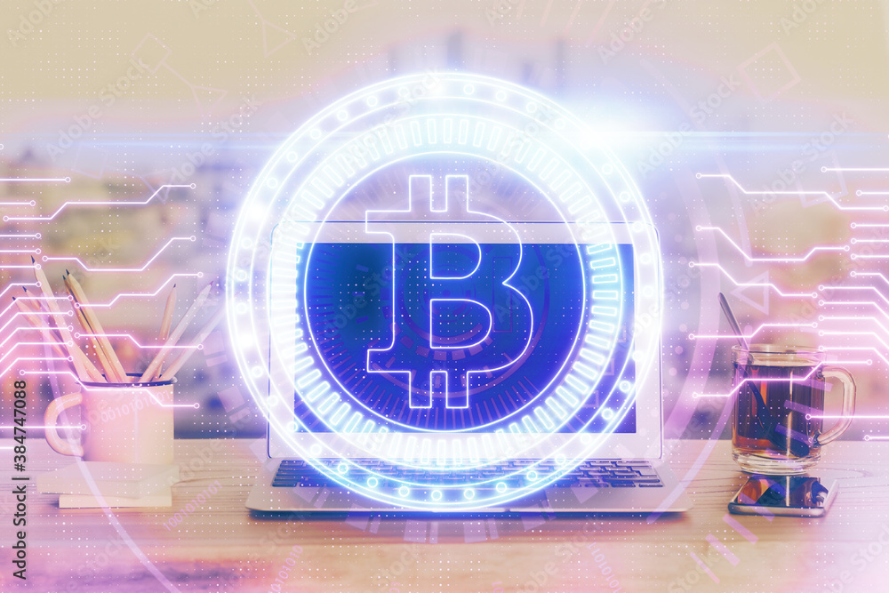 Double exposure of blockchain theme hologram and table with computer background. Concept of bitcoin crypto currency.