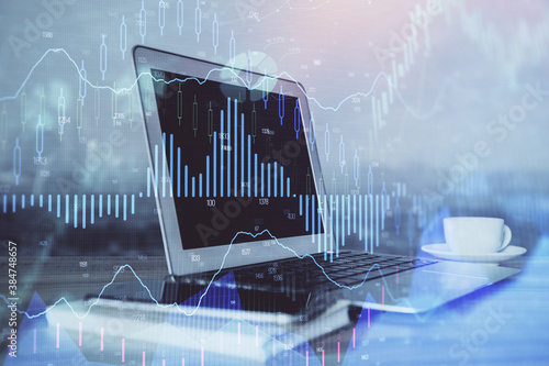 Forex market chart hologram and personal computer background. Double exposure. Concept of investment.