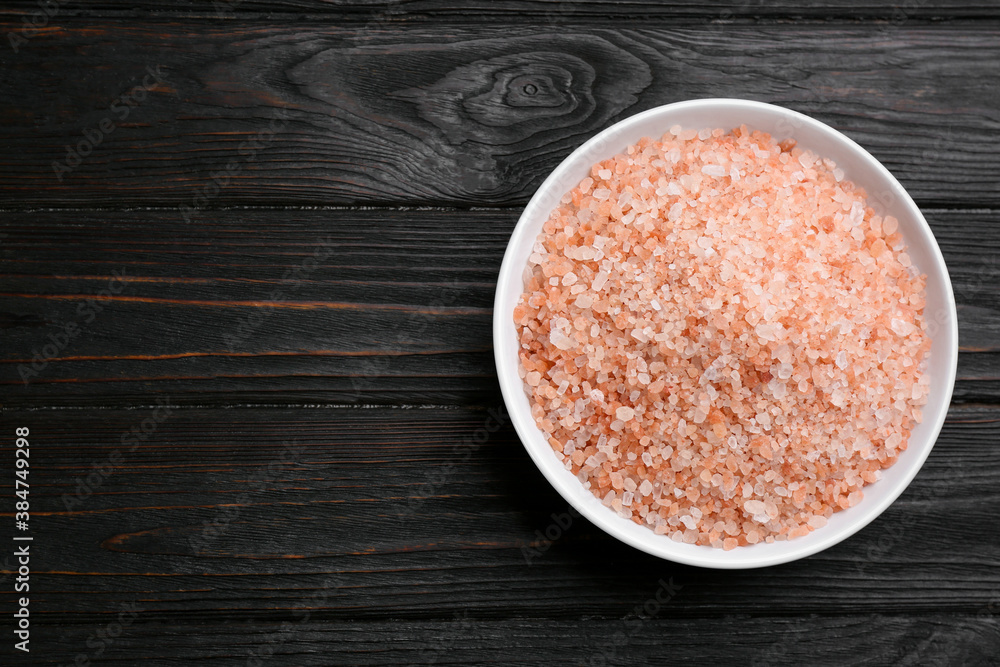 Pink himalayan salt on wooden table, top view. Space for text Pink himalayan salt on wooden table, top view. Space for text