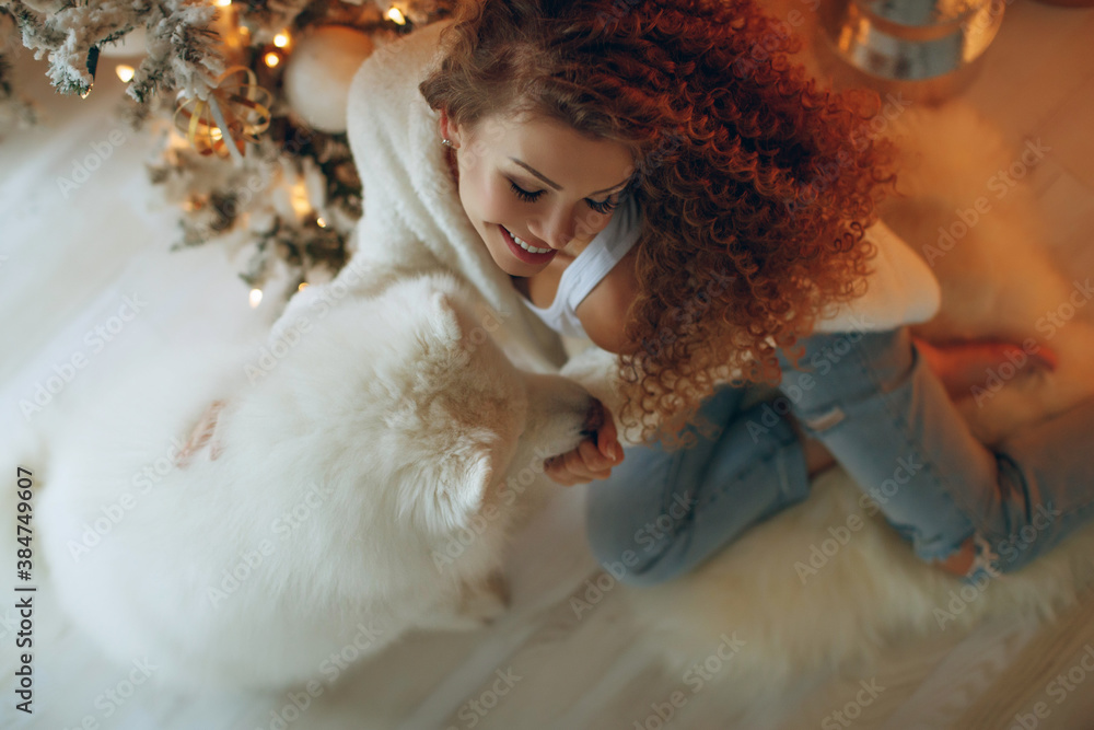 Beautiful woman in Christmas at home, festive decor. High quality photo. Beautiful woman in Christmas at home, festive decor. High quality photo.