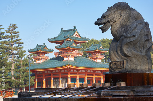 Dragon statue over water ablution basin with Byakko-ro Tower of Heian-jingu Shrine. Kyoto. Japan