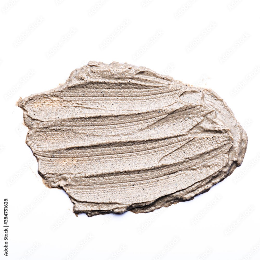 grey cosmetic smear on white background, clay stroke, copy space grey cosmetic smear on white background, clay stroke, copy space
