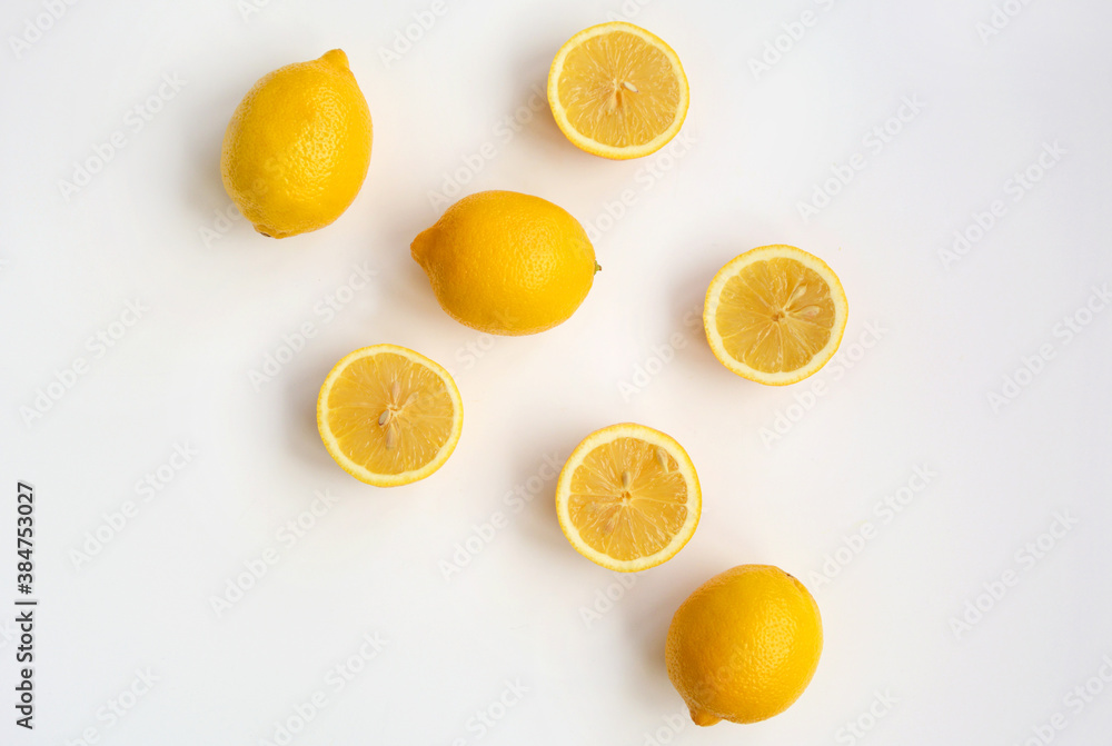 Fresh lemons lie on a white background