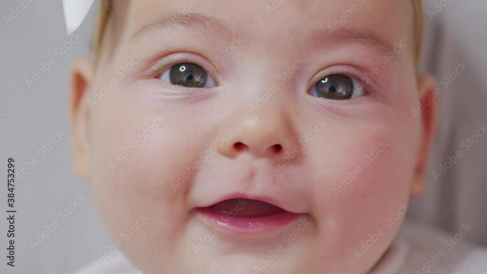 Cute baby smiling and looking in the camera close up. Cute baby smiling and looking in the camera close up.
