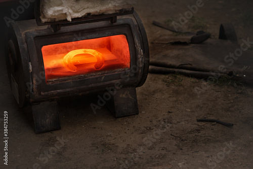Horseshoes are heated in an oven