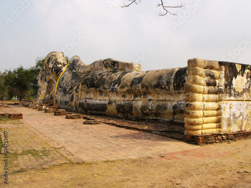 Ayutthaya, Thailand, January 24, 2013: Reclining Buddha in Ayutthaya, former capital of the kingdom of Siam. Thailand