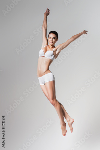 Wallpaper Mural beautiful jumping woman in underwear Torontodigital.ca