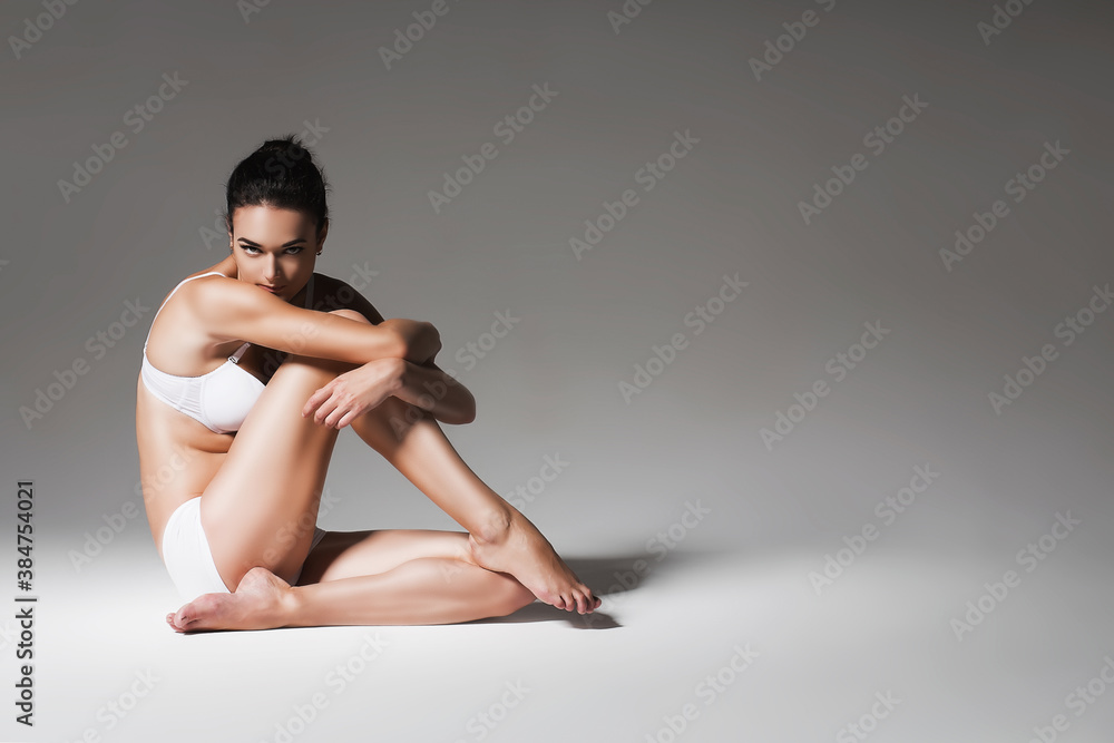 pretty healthy woman sitting on the floor pretty healthy woman sitting on the floor