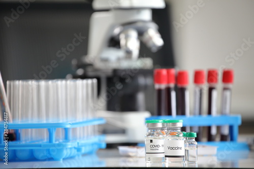 Fototapeta Naklejka Na Ścianę i Meble -  Sample batch of coronavirus vaccine in scientific laboratory unit being test with blood sample 