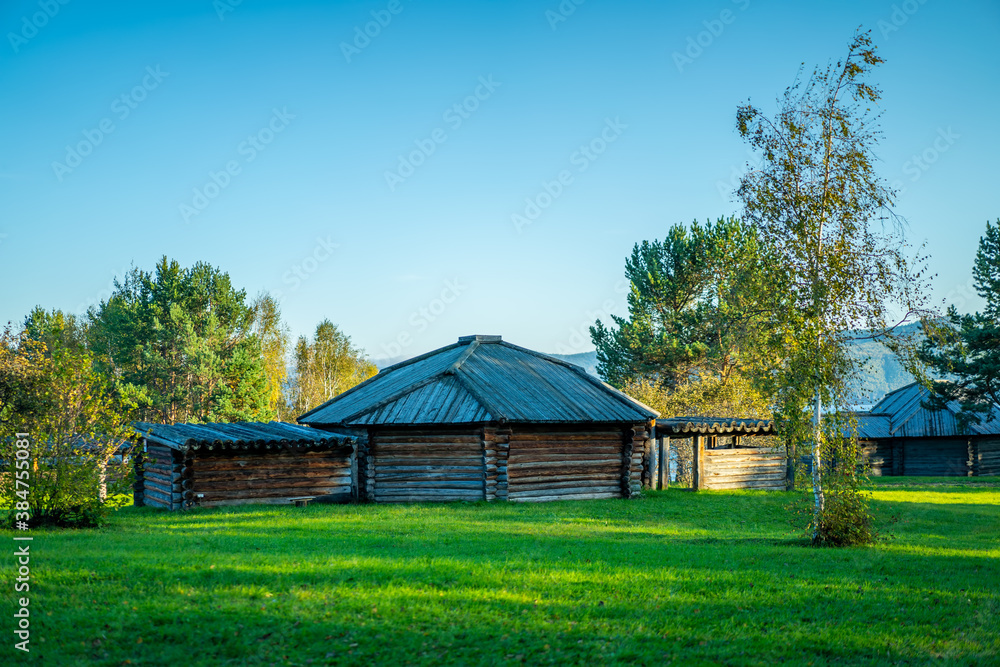 Natural landscape with wooden buildings.
