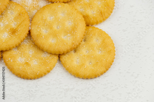 Pile of round cracker with sweet sugar isolated on white background