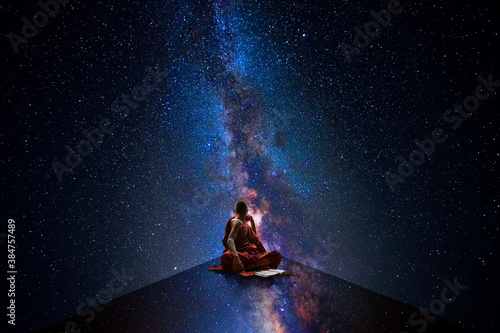 Buddhist novice looking at the universe