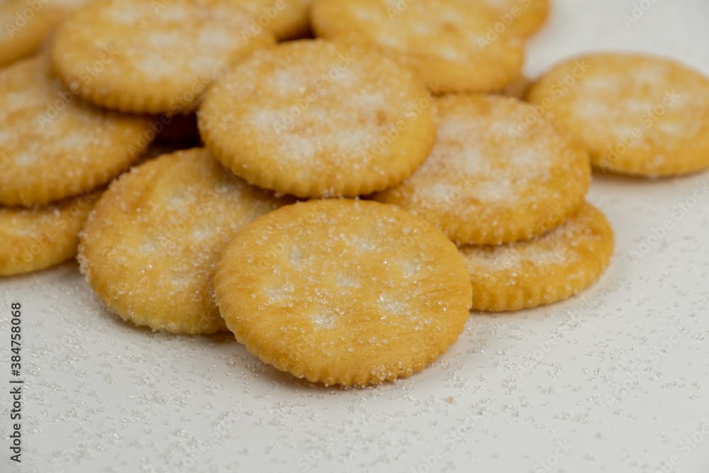 Pile of round cracker with sweet sugar isolated on white background Pile of round cracker with sweet sugar isolated on white background