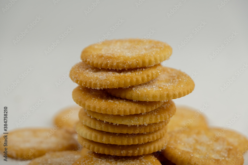 Pile of round cracker with sweet sugar isolated on white background Pile of round cracker with sweet sugar isolated on white background