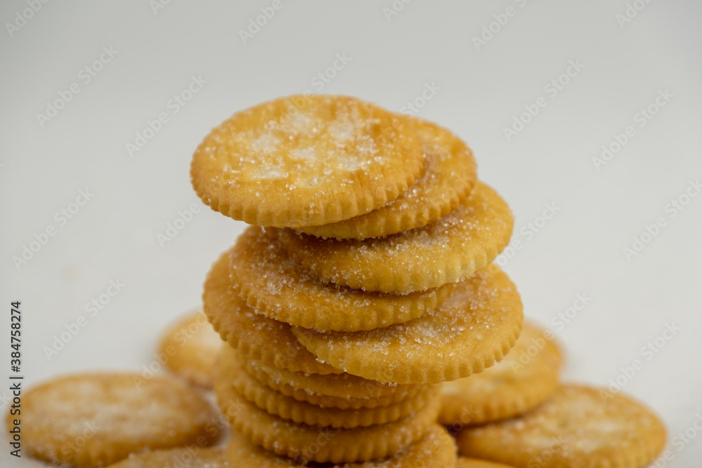 Pile of round cracker with sweet sugar isolated on white background Pile of round cracker with sweet sugar isolated on white background