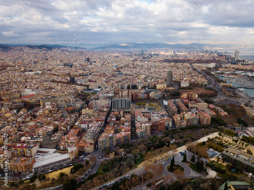 Aerial view of historical districts of Barcelona in cloudy day..