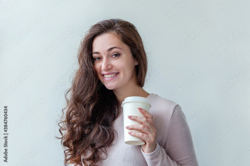 Beautiful young brunete woman with take away paper coffee cup isolated on white background. Happy smiling girl having lunch break. Morning drink resting leisure concept Beautiful young brunete woman with take away paper coffee cup isolated on white background. Happy smiling girl having lunch break. Morning drink resting leisure concept