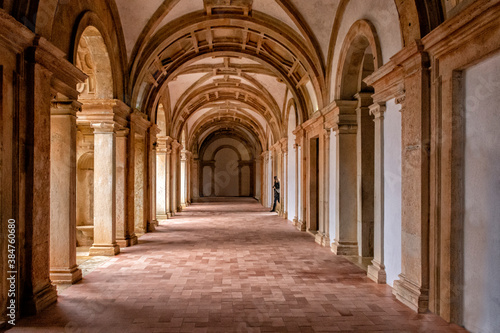 Side-lit Cloister Hallway With Columns And Ribbed Vaulted Ceilings. Templar Castle Convent Of Christ  Tomar  Portugal.
