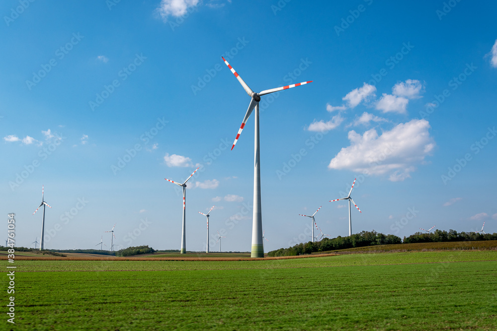 View on renewable energy windmills in a windpark in Neusiedl, Burgenland, Austria View on renewable energy windmills in a windpark in Neusiedl, Burgenland, Austria