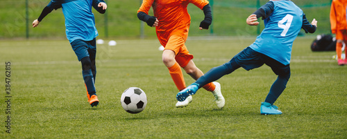 Boys Playing Soccer Game in Autumn Time. Footballers in Soccer Long Sleeve Jersey Clothing