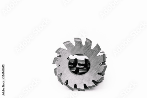 Several metal milling disc cutters for industrial equipment. The tool is isolated on a white background. Close-up