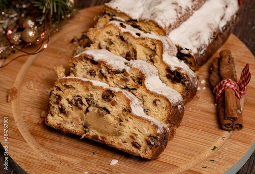 Sliced Christmas Stollen. Traditional German Christmas cake with dried fruit