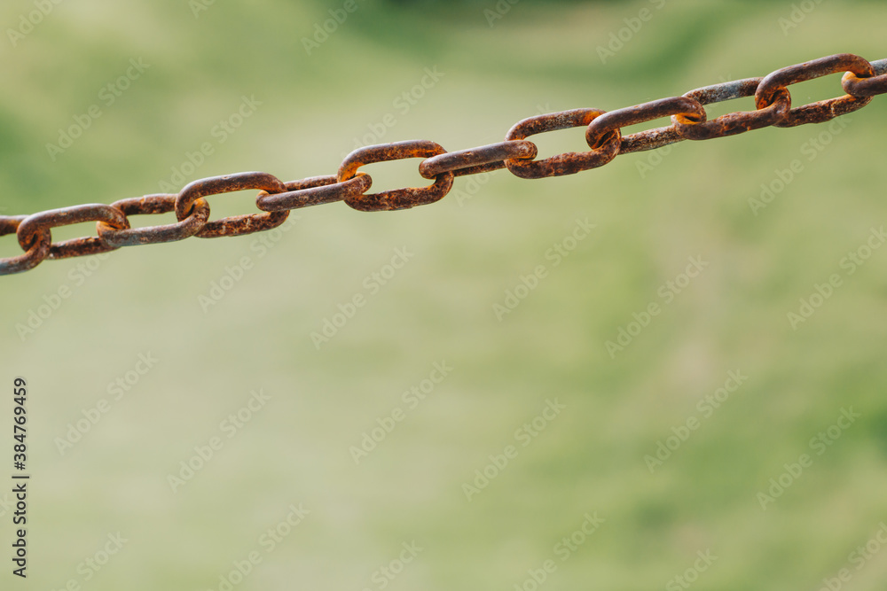Old rusty metal chain with blurred background Old rusty metal chain with blurred background