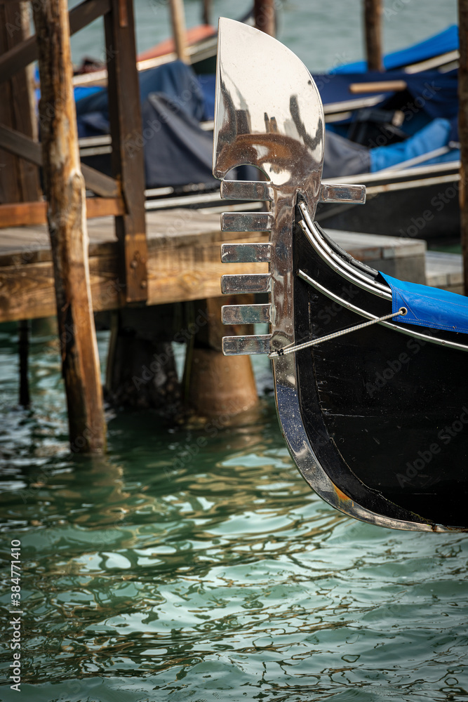 Venice, close-up of a Gondola prow , typical Venetian rowboat, Canal Grande, UNESCO world heritage site, Veneto, Italy, Europe.