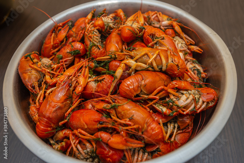 Large bowl of fresh boiled crawfish with dill from above