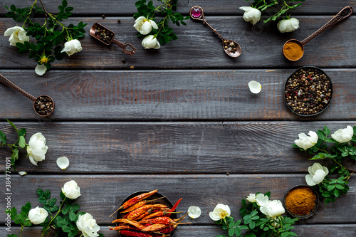 Set of hot Indian spices with flowers, top view