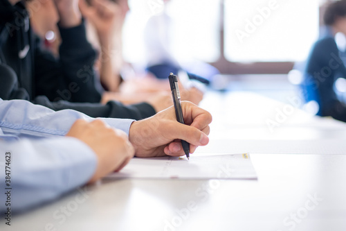 People Making Notes In A Lecture