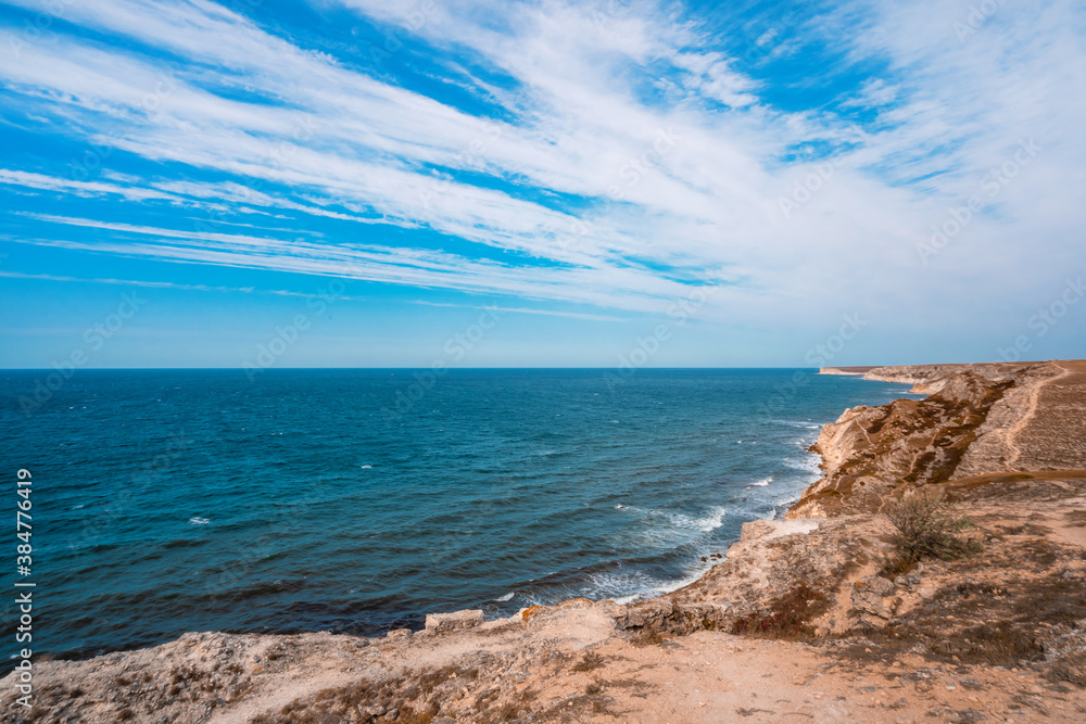 Black sea coastline with cliffs, rocks, turquoise waves and sea foam. Breathtaking, scenery landscape in Crimea