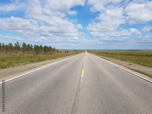 Empty asphalt road in the steppe