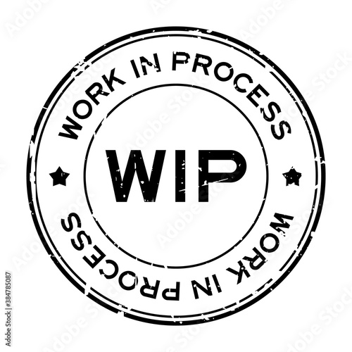 Grunge black WIP work in process word round rubber seal stamp on white background
