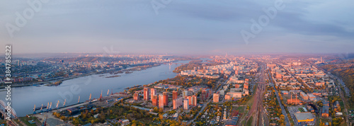 evening panorama of the city in Siberia and the Yenisei river at sunset. Right Bank of Krasnoyarsk