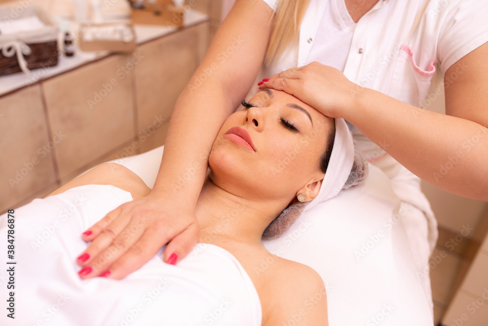 Woman having a facial spa and beauty massage