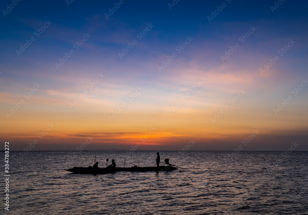 fishing boat at sunset in the evening