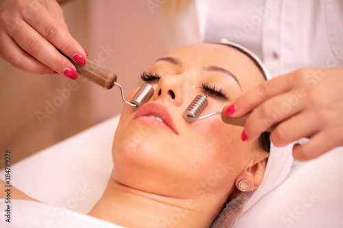 Close up view of a woman getting a facial massage