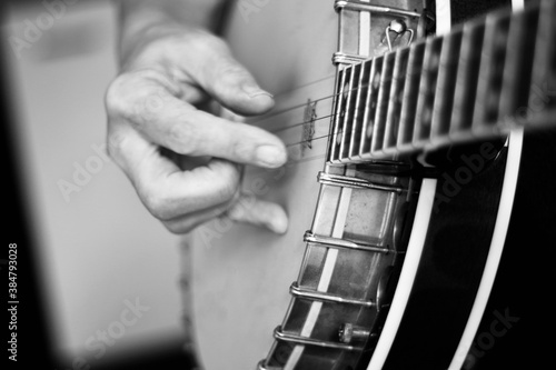 Close up of hands playing the banjo