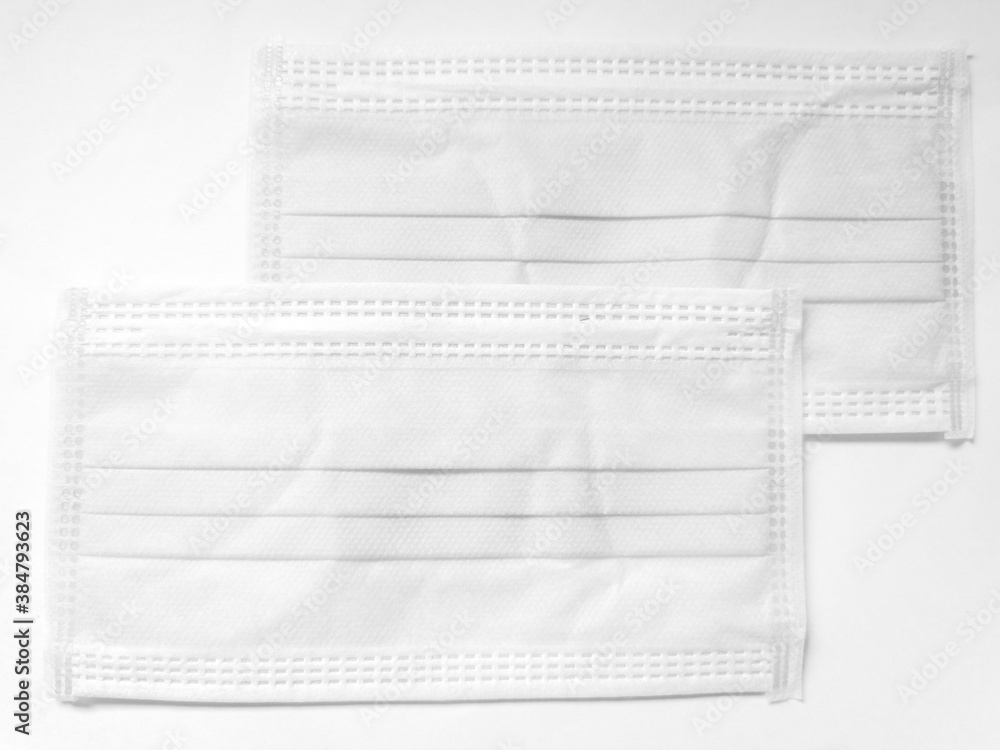 White surgical face mask on white background, Health care concept and can protect virus covid-19, medical masks, fabric mask protect air pollution White surgical face mask on white background, Health care concept and can protect virus covid-19, medical masks, fabric mask protect air pollution